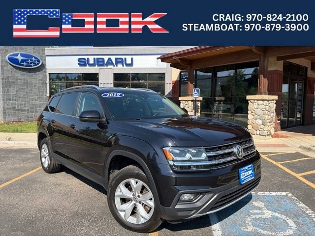 2019 Volkswagen Atlas 3.6L V6 SE w/Technology in Black — front three-quarter view